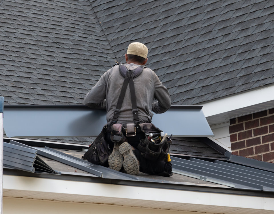 worker working in roof installing