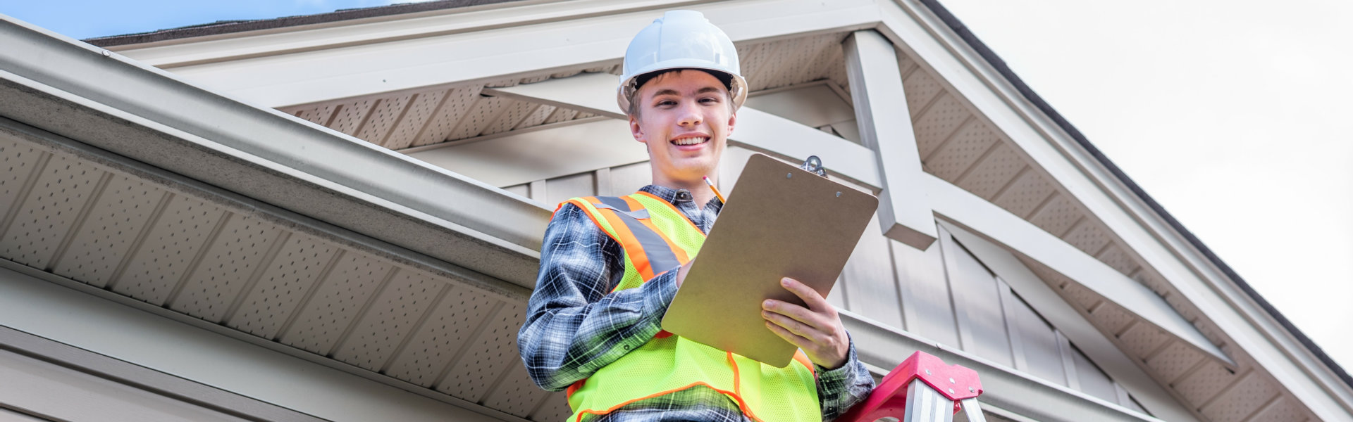 young carpenter holding clipboard