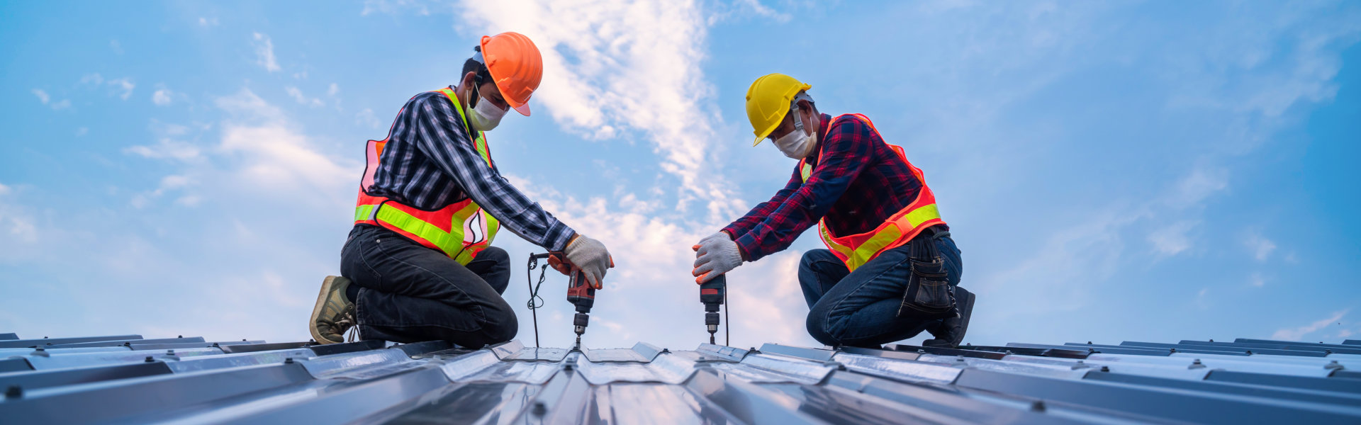 two workers working in roof